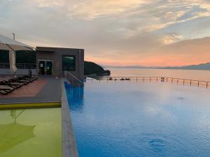 a swimming pool with a view of the water at Goheung Sun Valley Resort in Goheung
