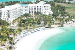 an aerial view of the beach at the resort at Luz de Laguna in Playa Blanca