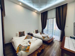 Cama o camas de una habitación en 若溪酒店 ruoxi hotel