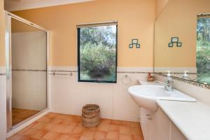 a bathroom with a sink and a shower at Yallingup Valley Views in Yallingup +23 photos