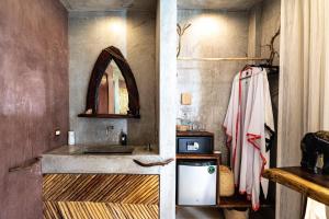 a bathroom with a sink and a mirror at Xkeban Tulum Adults Only in Tulum +45 photos