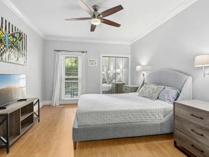 En eller flere senge i et værelse på Southern City Living