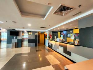 a lobby of a store with a display case at Ajang Hotel in Miri