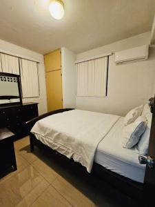 Postel nebo postele na pokoji v ubytování 1 Bedroom, 1 Bathroom at Joe's Place