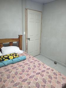 Ένα ή περισσότερα κρεβάτια σε δωμάτιο στο Casa Pura Vida Arenal