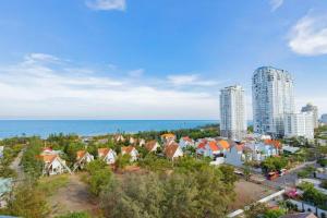 an aerial view of a city with buildings and the ocean at The Sóng Apartment Vũng Tàu - Nhà Chill in Vung Tau