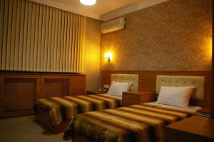 Postel nebo postele na pokoji v ubytování Hopa Heyamo Hotel