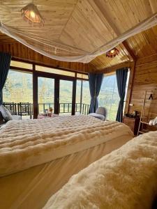 Postel nebo postele na pokoji v ubytování Hmong House - Sapa Retreat