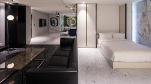 a hotel room with a bed and a couch at Stayrak Hotel in Seoul