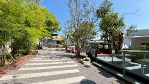 A garden outside Duck House Hostel & Resort Khon Kaen