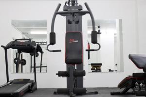 a gym with two exercise bikes in a room at UTD8 Hotel and Residence in Bangkok