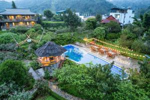 an aerial view of a resort with a swimming pool at Stone Garden Resort & Spa in Sa Pa