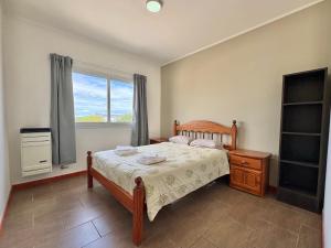 Postel nebo postele na pokoji v ubytování Olavarria suite