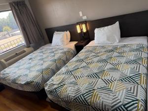 Postel nebo postele na pokoji v ubytování Motel 6 Gulfport, MS Airport + 12 fotografií