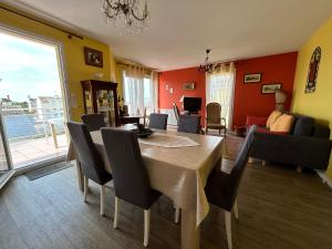 a dining room with a table and chairs at Appartement Tout Confort entre Plage et Commerces à Saint-Brevin-les-Pins - FR-1-364-55 in Saint-Brevin-les-Pins