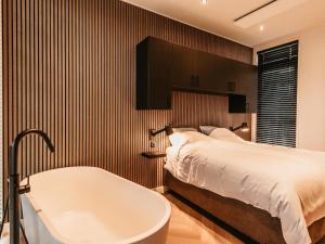 Ένα ή περισσότερα κρεβάτια σε δωμάτιο στο Modern holiday home in Kesteren