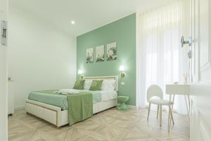 En eller flere senge i et værelse på boutique teatro b&b