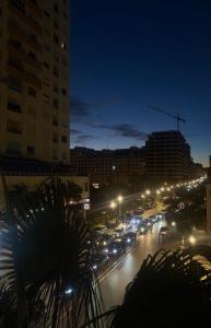 a city street filled with traffic at night at Spacious Appartment in the heart of Tangier with 2 living rooms, 2 bedrooms KING SIZE beds, 2 baths, 2 patios in Tangier