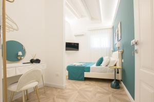 TV a/nebo společenská místnost v ubytování boutique teatro b&b