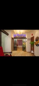 a living room with a couch and a table at SM Stay Inn in Mangalore