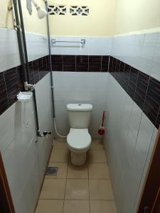 Ένα μπάνιο στο No 62, Taman Pelangkah