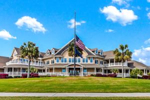 a large house with an american flag in front at TL812: 812 Treeloft Trace in Seabrook Island