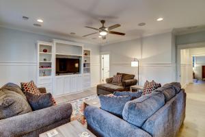 a living room with two couches and a tv at AV3-23: 3 23rd Avenue in Isle of Palms