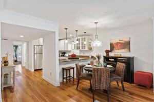a kitchen and dining room with a table and chairs at SG7A: 7A Seagrove Villa in Isle of Palms