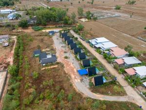 an aerial view of a farm with a bunch of houses at Phimpakan guesthouse in Nakhon Phanom