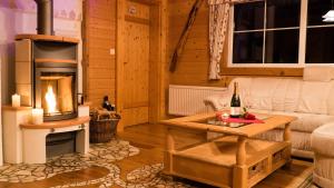 Area soggiorno di Almdorf im Winkl - Blockhüttendorf in Gröbming
