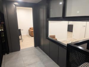 a view of a living room from inside a house at Munibung Apartments in Cardiff +25 photos