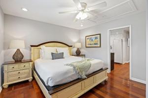 a bedroom with a bed and a ceiling fan at AV3-20: 3 20th Avenue in Isle of Palms