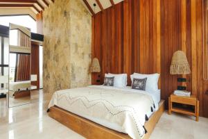 Ένα ή περισσότερα κρεβάτια σε δωμάτιο στο Batu Bingin Villa +19 φωτογραφίες