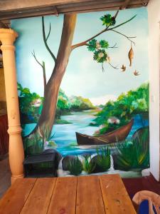 a mural of a river with boats on it at Ella Summer Leisure in Ella