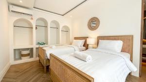 Ένα ή περισσότερα κρεβάτια σε δωμάτιο στο Modern Sanctuary Luxury 3BR Escape in Berawa +27 φωτογραφίες