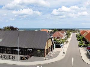 a town with a building on the side of a street at 6 person holiday home in Hadsund in Hadsund