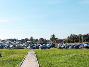 a bunch of cars parked in a parking lot at 6 person holiday home in Hadsund in Hadsund