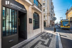 a bus is parked in front of a building at Pestana CR7 Lisboa in Lisbon