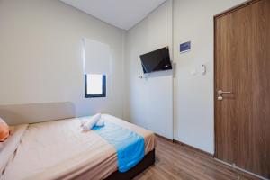 TV a/nebo společenská místnost v ubytování Sans Stay Bintaro