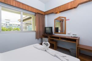 TV a/nebo společenská místnost v ubytování Riverside Hotel + 37 fotografií