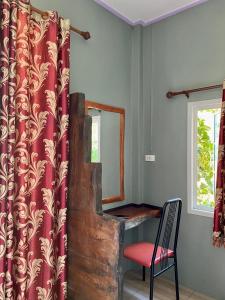a mirror and a chair in a room at Sonya Kohlanta in Ko Lanta +26 photos