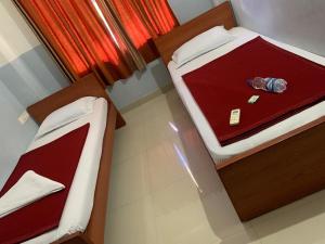 Postel nebo postele na pokoji v ubytování Q8 Hom, hygienic Rooms, Payyoli