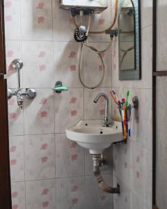 a bathroom with a sink and a shower at 'Timeless Bhaktapur Home' in Bhaktapur