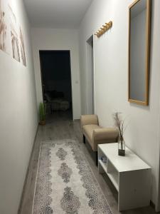 a living room with a couch and a table at MelsHome Entire apartment to feel good in Geislingen an der Steige +2 photos