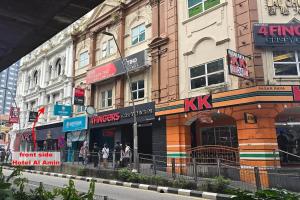 a group of buildings on a city street at Hotel AL Amin in Kuala Lumpur