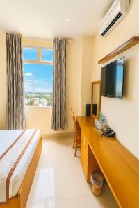 Μια τηλεόραση ή/και κέντρο ψυχαγωγίας στο Quê Tôi 2 Hotel