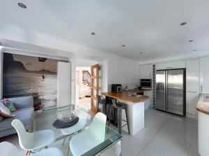 a kitchen and living room with a table and chairs at Hamble Haven in Lower Swanwick +16 photos