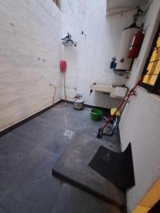 a room with a concrete floor and a wall at Casa Ana Victoria in Morelia +11 photos