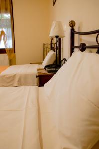 A bed or beds in a room at Nefeli