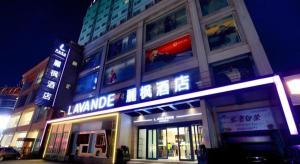 a store front of a building at night at Lavande Hotels Changzhi City God Temple in Changzhi